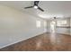 Bright, open living room featuring tile flooring, ceiling fans, and natural light through a window at 1911 Jarvis Rd, Pahrump, NV 89060