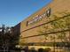 Close-up of the America First Center in Henderson with lush landscaping at 203 W Pacific Ave, Henderson, NV 89015