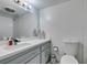 Clean bathroom with grey vanity, modern fixtures, and decorative accents at 205 E Harmon Ave # 511, Las Vegas, NV 89169