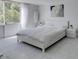 Serene bedroom with a white bed and decor at 205 E Harmon Ave # 511, Las Vegas, NV 89169