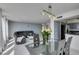 Bright dining area with modern table set, open to the living area and kitchen at 205 E Harmon Ave # 511, Las Vegas, NV 89169