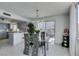 Elegant dining area with modern table set and natural light, and adjacent kitchen at 205 E Harmon Ave # 511, Las Vegas, NV 89169