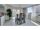 Bright dining area with modern table set, balcony access, and lots of natural light at 205 E Harmon Ave # 511, Las Vegas, NV 89169