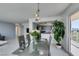 Bright dining area with modern table set, balcony access, and view of the kitchen at 205 E Harmon Ave # 511, Las Vegas, NV 89169