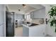Charming kitchen featuring grey cabinets, updated appliances, and sleek countertops at 205 E Harmon Ave # 511, Las Vegas, NV 89169