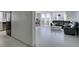 Bright living room featuring tile flooring, a modern gray sofa, and an open floor plan with large bright windows at 205 E Harmon Ave # 511, Las Vegas, NV 89169