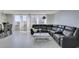 Light-filled living space with tile floors, dining area, and comfortable gray sectional sofa at 205 E Harmon Ave # 511, Las Vegas, NV 89169