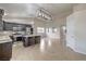 Open kitchen boasts granite counters, stainless appliances, tile backsplash, and island with seating at 2073 Paterno Ave, Las Vegas, NV 89123