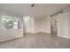 Spacious living room with tile floors, a front door and ample natural light at 2073 Paterno Ave, Las Vegas, NV 89123