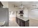 Open floor plan features an eat-in kitchen with granite counters and an island with seating at 2073 Paterno Ave, Las Vegas, NV 89123