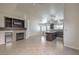 Stylish living space with tile flooring, a fireplace, wine cooler, and an island in the kitchen at 2073 Paterno Ave, Las Vegas, NV 89123