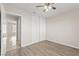 Bedroom featuring wood-look floors and closet at 2315 Opponents Ridge St, North Las Vegas, NV 89032