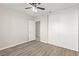 Bedroom features wood-look floors, closet, and access to bathroom at 2315 Opponents Ridge St, North Las Vegas, NV 89032