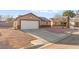 A single-story house with a two-car garage, driveway, and minimal desert landscaping at 2315 Opponents Ridge St, North Las Vegas, NV 89032