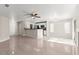 Bright open-concept space featuring tile flooring that connects the living and kitchen areas at 2315 Opponents Ridge St, North Las Vegas, NV 89032