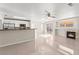 Spacious open floorplan showcasing tile floors, a fireplace and stainless steel appliances at 2315 Opponents Ridge St, North Las Vegas, NV 89032