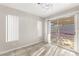 Bright living space featuring tile floors and sliding glass doors to the backyard at 2315 Opponents Ridge St, North Las Vegas, NV 89032