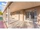 Covered patio with sliding glass doors offers a seamless transition between indoor and outdoor living spaces at 2315 Opponents Ridge St, North Las Vegas, NV 89032
