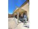 Home exterior with covered patio and gravel backyard at 2409 W Gilmore Ave, North Las Vegas, NV 89032