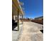 Wide angle of the expansive backyard under a clear blue sky at 2409 W Gilmore Ave, North Las Vegas, NV 89032