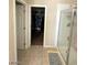 Bathroom featuring walk-in shower and view to the walk-in closet at 2409 W Gilmore Ave, North Las Vegas, NV 89032