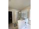 Bathroom featuring walk-in shower and soaking tub at 2409 W Gilmore Ave, North Las Vegas, NV 89032