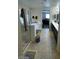 Bathroom featuring a glass-enclosed shower, a double sink vanity, and view into a bedroom at 2409 W Gilmore Ave, North Las Vegas, NV 89032