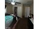 Comfortable bedroom with access to closet and adjoining room at 2409 W Gilmore Ave, North Las Vegas, NV 89032