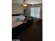 Bedroom with window, ceiling fan, and black bed frame at 2409 W Gilmore Ave, North Las Vegas, NV 89032