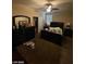 Spacious bedroom with a ceiling fan, closet and dresser at 2409 W Gilmore Ave, North Las Vegas, NV 89032