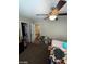Bedroom with neutral colors, closet, and ceiling fan at 2409 W Gilmore Ave, North Las Vegas, NV 89032