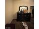 Bedroom with a large dresser and mirror at 2409 W Gilmore Ave, North Las Vegas, NV 89032