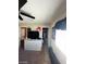 View of bedroom featuring carpet floors, ceiling fan and walk-in closet at 2409 W Gilmore Ave, North Las Vegas, NV 89032