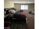 Bedroom with a large window, plush carpeting, and contemporary furnishings at 2409 W Gilmore Ave, North Las Vegas, NV 89032