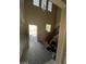 Bright foyer with high ceilings, hardwood floors, stairs, and natural light at 2409 W Gilmore Ave, North Las Vegas, NV 89032