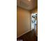 Neutral hallway with carpet floors and a view into a bedroom at 2409 W Gilmore Ave, North Las Vegas, NV 89032