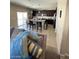 Open-concept kitchen boasts modern appliances, a center island, and barstool seating at 2409 W Gilmore Ave, North Las Vegas, NV 89032