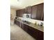 Modern kitchen boasts stainless steel appliances, granite countertops and plenty of cabinet storage at 2409 W Gilmore Ave, North Las Vegas, NV 89032