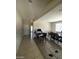 Open-concept living room with tile floors and comfortable seating at 2409 W Gilmore Ave, North Las Vegas, NV 89032