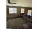 Bright living room features a plush area rug, and direct access to the exterior via a sliding glass door at 2409 W Gilmore Ave, North Las Vegas, NV 89032
