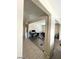 Open-concept living room with tile floors and comfortable seating at 2409 W Gilmore Ave, North Las Vegas, NV 89032