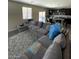 Open-concept living room flows seamlessly into a kitchen, providing an ideal layout for modern living at 2409 W Gilmore Ave, North Las Vegas, NV 89032