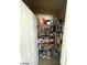 Open view of the walk-in pantry with shelving full of pantry items in a bright space at 2409 W Gilmore Ave, North Las Vegas, NV 89032