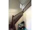 Carpeted stairs with decorative wooden banister and window at 2409 W Gilmore Ave, North Las Vegas, NV 89032