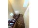 Top view of the staircase with carpeted steps and wooden banister at 2409 W Gilmore Ave, North Las Vegas, NV 89032