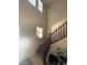 View of the staircase with blinds on the window at 2409 W Gilmore Ave, North Las Vegas, NV 89032