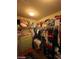 Walk-in closet with built in shelving, hanging clothes, and plenty of storage at 2409 W Gilmore Ave, North Las Vegas, NV 89032