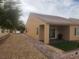 Wide backyard view showcases covered patio with artificial grass and low maintenance landscape at 2704 Willow Wren Dr, North Las Vegas, NV 89084