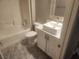 Bathroom includes a white vessel sink, white vanity and shower-tub combination at 2704 Willow Wren Dr, North Las Vegas, NV 89084