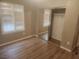 Bedroom featuring a closet with mirrored doors and plantation shutters at 2704 Willow Wren Dr, North Las Vegas, NV 89084